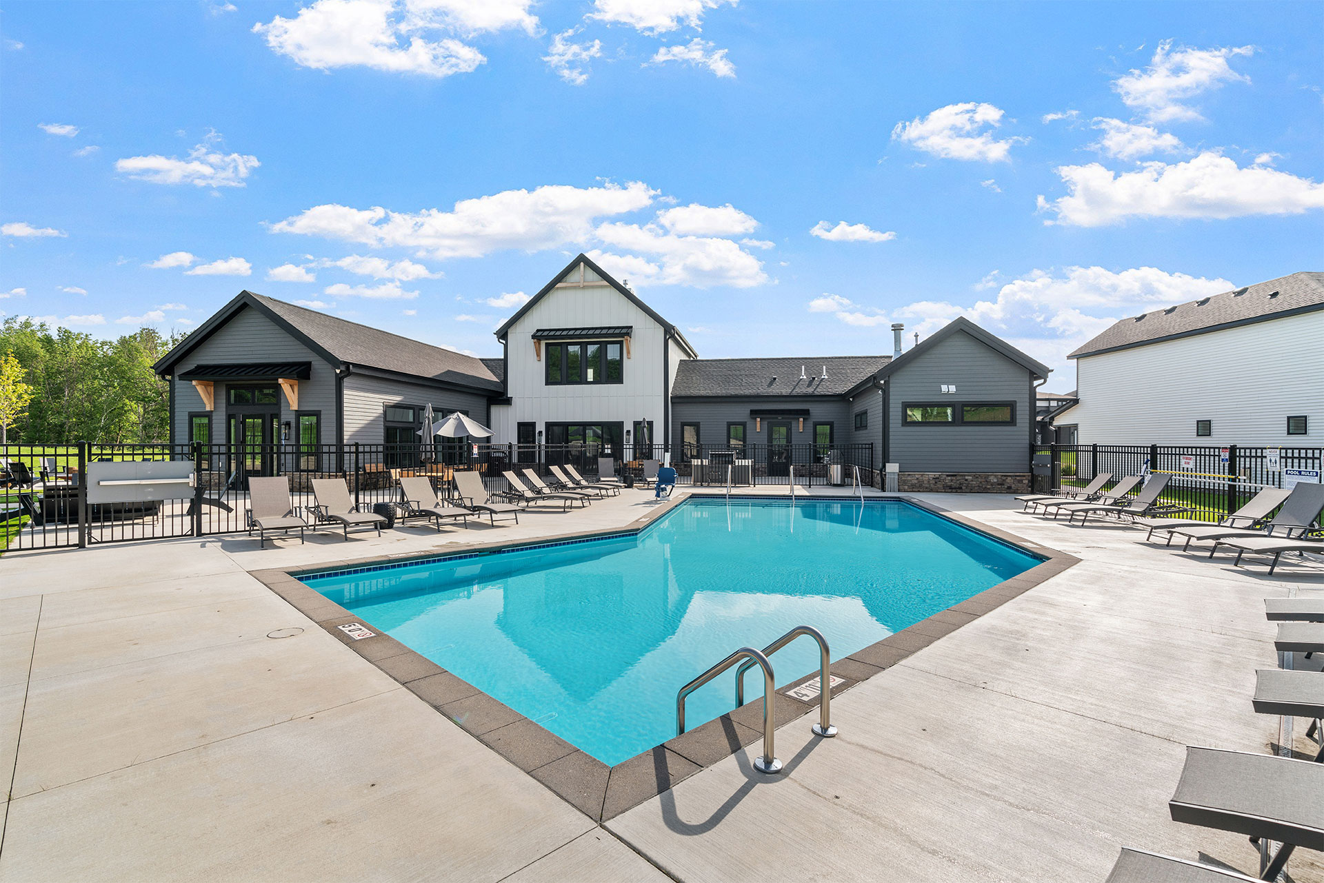 victoria ridge outdoor pool and sundeck with lounge chairs